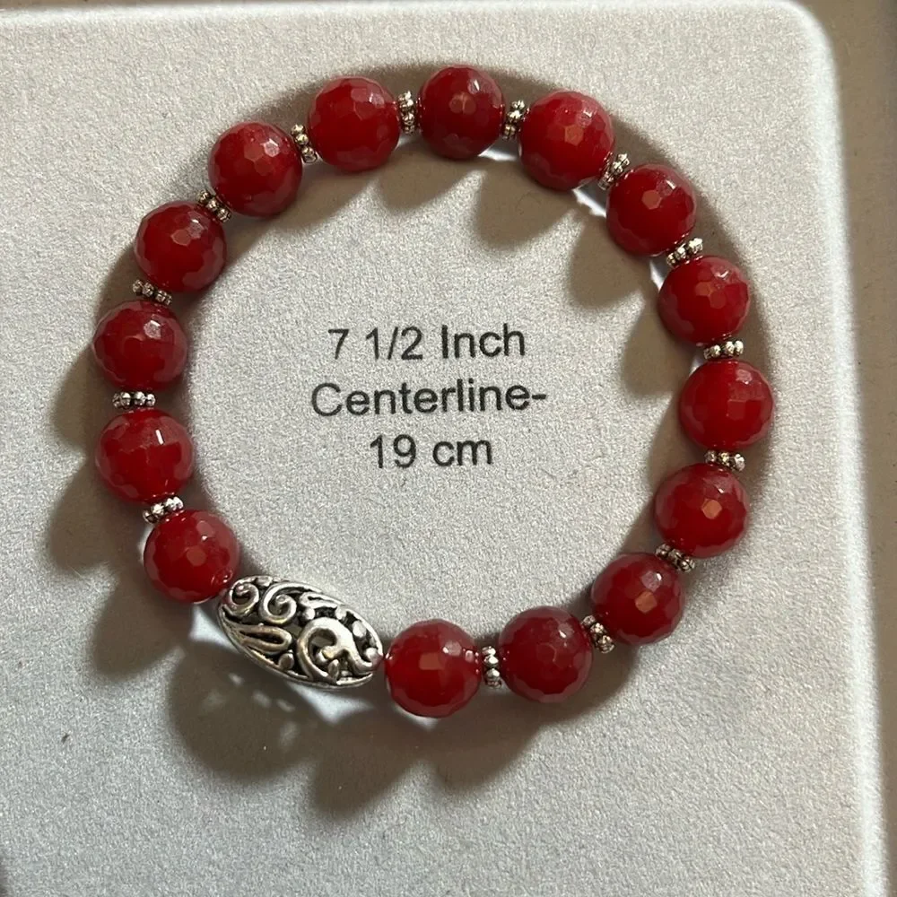 Handcrafted beaded bracelet with metal bead detail